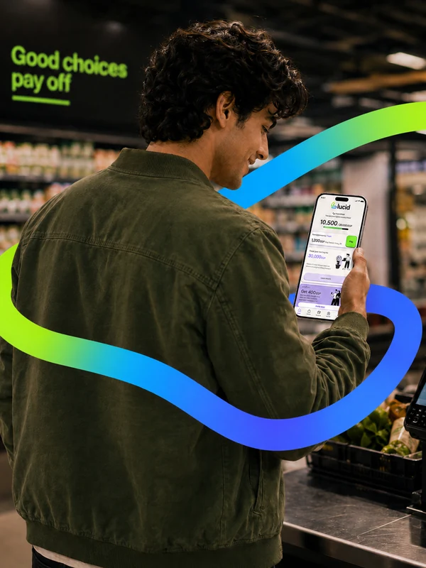 A shopper paying for groceries with Lucid